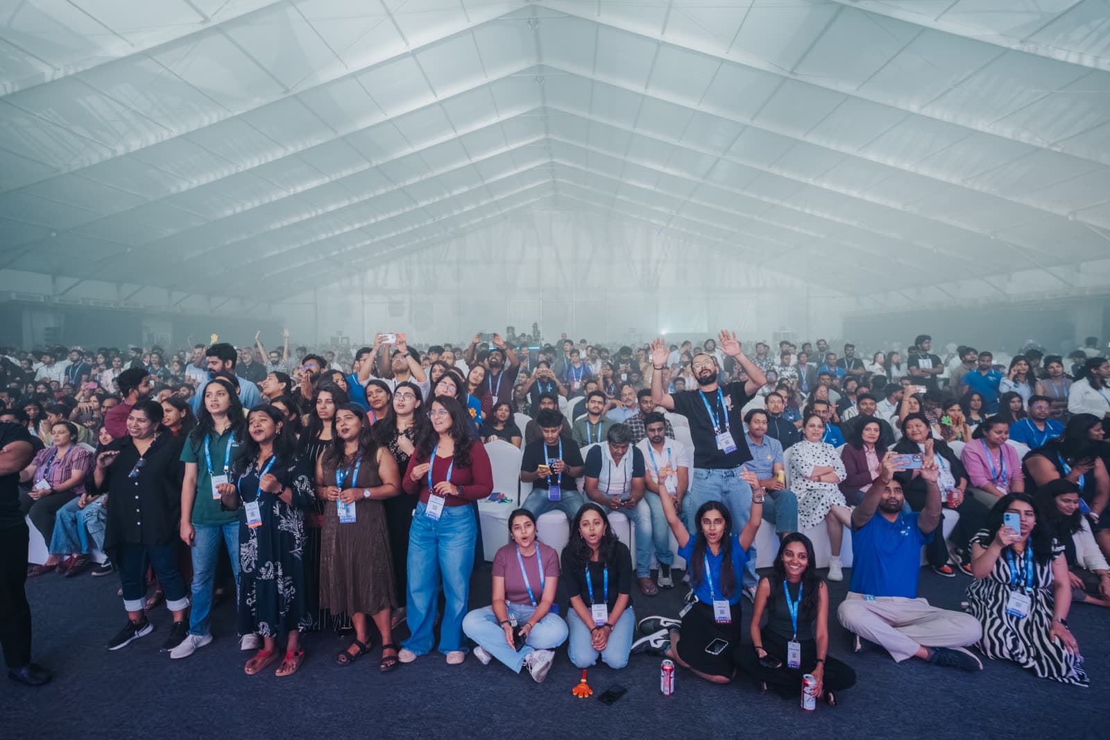 Agam audience singing along inside a large tented venue